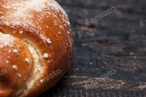 Preview: Rustic bread on wood table. Dark woody background with free text space.