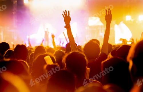 Preview: Crowd of concert stage lights and people fan audience silhouette raising hands or glow stick holding