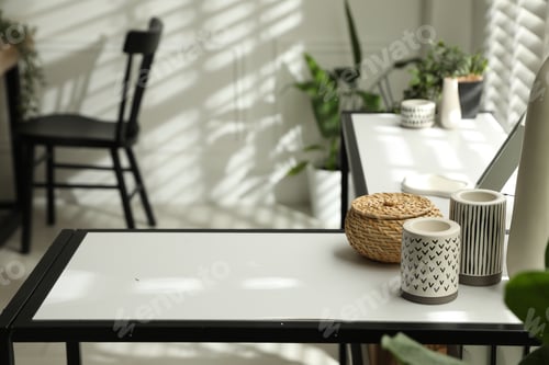 Preview: Console table with different decor and chair indoors, closeup. Interior design