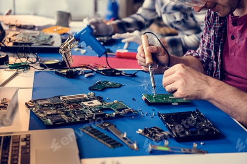 Preview: Hand soldering tin on electronics circuit board