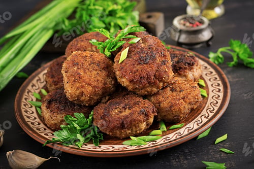 Preview: Juicy delicious meat cutlets on a dark table. Russian cuisine.
