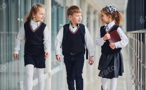 Preview: School kids in uniform together in corridor. Conception of education