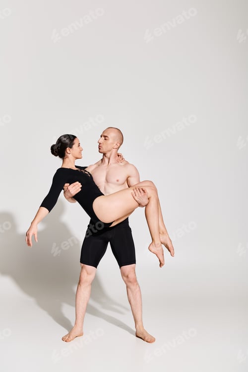 Preview: Shirtless Young Man Holds Woman in an Acrobatic Dance Pose