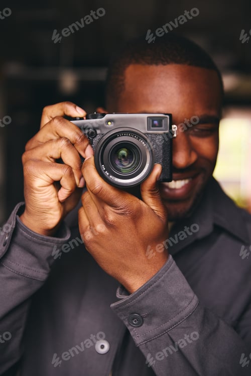 Preview: Photographer Taking A Picture With Camera Looking Through Lens