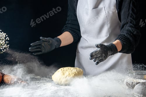 Preview: front view female cook throwing dough into the white flour on dark background dough egg job bakery