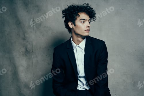 Preview: business man in suit self confidence curly hair fashion studio