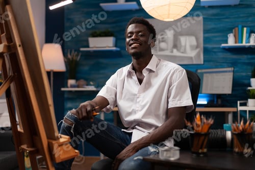 Preview: Portrait of smiling man illustrator smiling with graphic pencil in hand