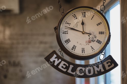 Preview: Vintage clock with roman number and welcome label hanging