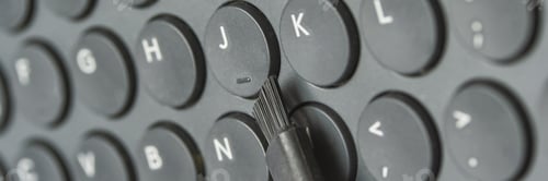 Preview: Close-up of a black electronic keyboard displaying alphabetical keys