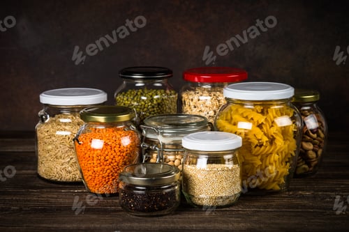 Preview: Cereals, Legumes, and beans in glass jars on kitchen table