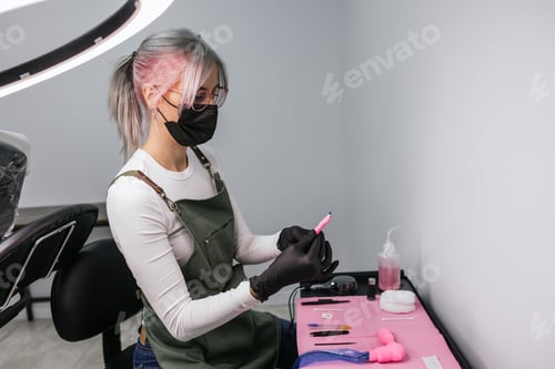 Preview: Professional beautician preparing for eyebrow microblading procedure