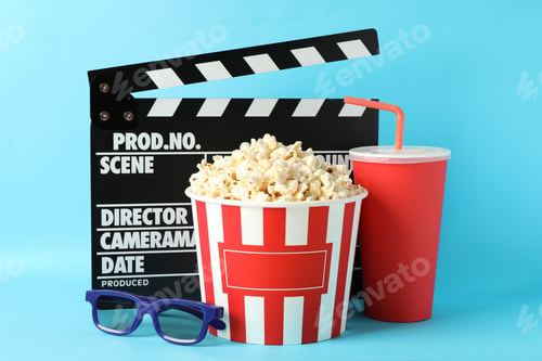Preview: Clapperboard, bucket with popcorn, drink and 3d glasses on blue background