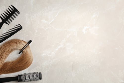 Preview: Flat lay composition with professional hairdresser tools on grey background
