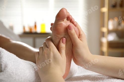 Preview: Woman receiving foot massage in spa salon, closeup