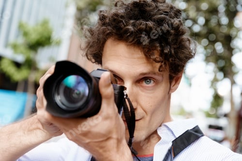 Preview: Male photographer taking picture