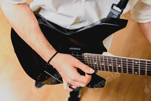Preview: Placing the fingers on a guitar to play some notes by a professional guitarist.