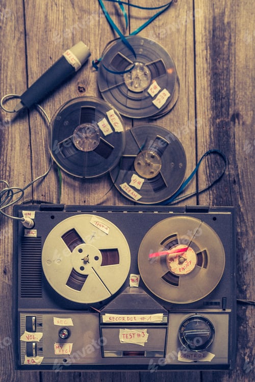 Preview: Old audio reel recorder with roll of tape and microphone