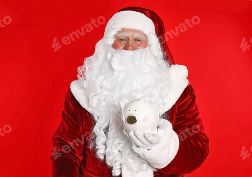 Preview: Santa Claus holding piggy bank on red background