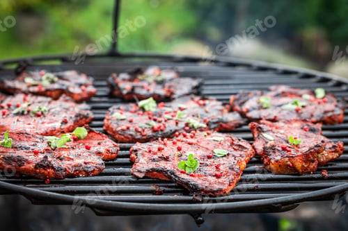 Preview: Fresh and spicy pork neck with spices on a grill
