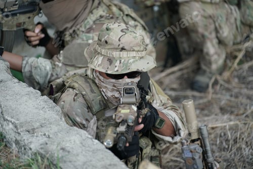 Preview: Soldier in full US MARSOC armed with assault rifle run through the abandoned building. Military