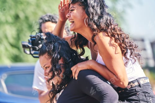 Preview: Joyful friends laughing on a sunny day