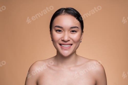 Preview: Portrait of a Smiling Woman on a Neutral Colored Background
