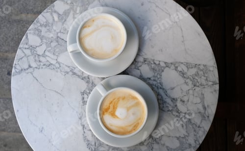 Preview: Two Cappuccinos on a Marble Table