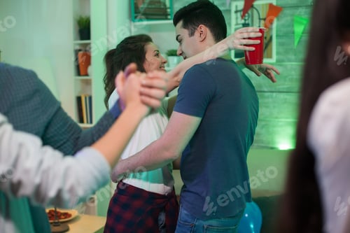 Preview: Beautiful young woman with arms around her boyfriend neck