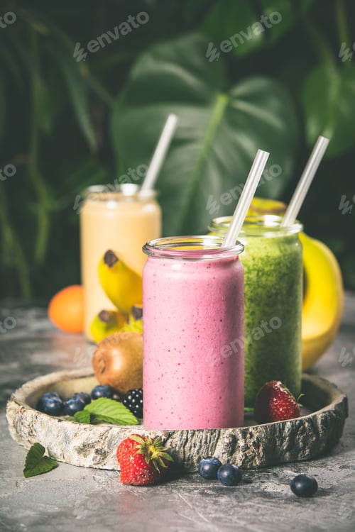 Preview: Fresh smoothies on tropical background, close up