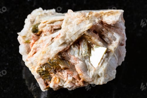 Preview: sample of raw albite rock with muscovite on black