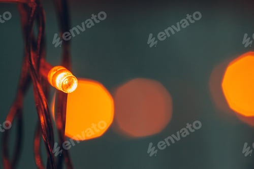 Preview: Illuminated garland close up on dark background