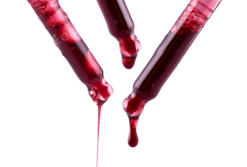 Preview: serum pipette with a falling drop on a white background