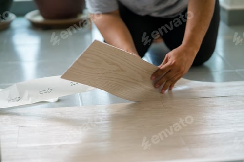 Preview: Vinyl floor installation, worker, DIY at home.