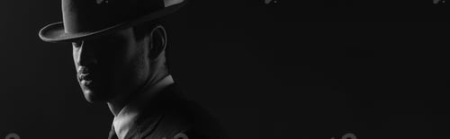 Preview: Monochrome image of mafioso with felt hat isolated on black, panoramic shot
