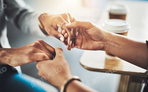 Preview: All will get better soon. Closeup shot of two women holding hands.