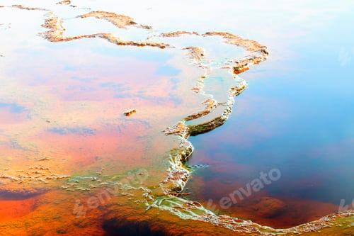 Preview: Colorful sediments in water of river