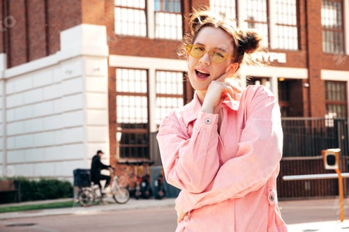 Preview: Young beautiful hipster girl posing outdoors