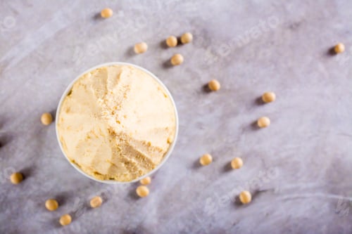 Preview: Japanese seasoning miso fermented from soy and koji rice in a bowl on the table. Top view. Closeup