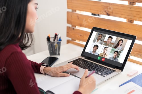 Preview: Asian business woman talking to colleague team about plan in video conference at home.