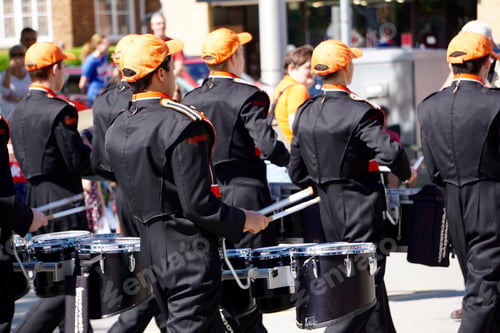Preview: Drumline playing drums in marching band in parade