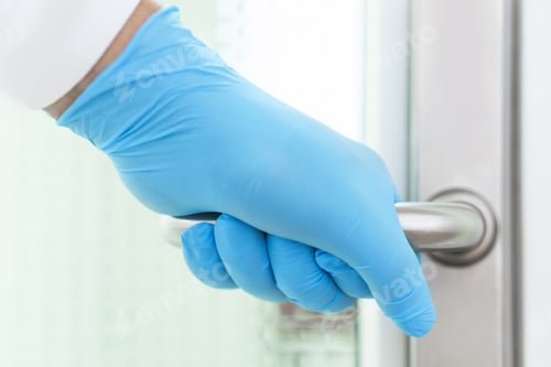 Preview: Gloved Hand Holds Door Handle Inside Room