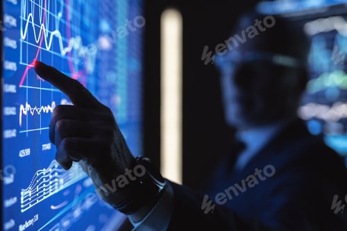 Preview: The old businessman working on the big blue screen with graphics