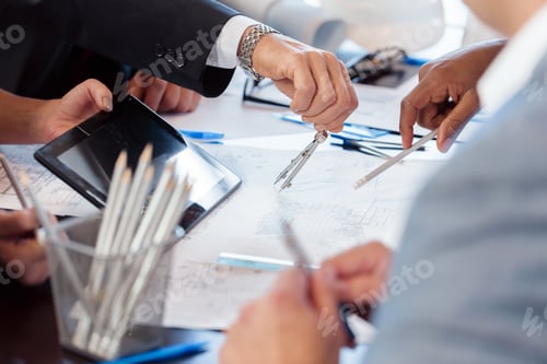 Preview: Business team collaborating on project plans with digital tools and drafting materials