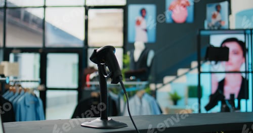 Preview: Empty shopping mall with casual or formal wear brands