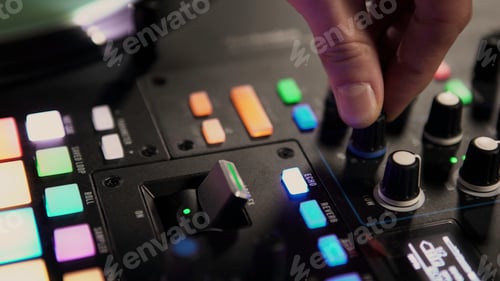 Preview: Music at the party. Art. DJ on his remote creates music for vacationing people.