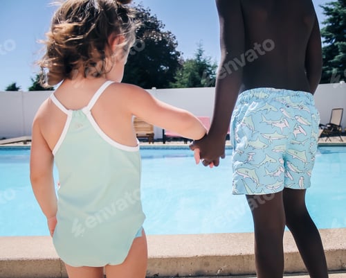 Preview: Two Children Holding Hands near Outdoor Swimming Pool