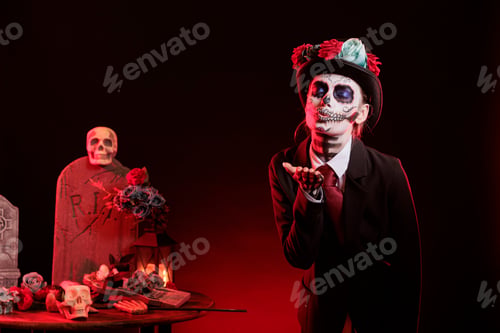 Preview: Portrait of girl blowing kiss at Dia de los Muertes indigenous rites