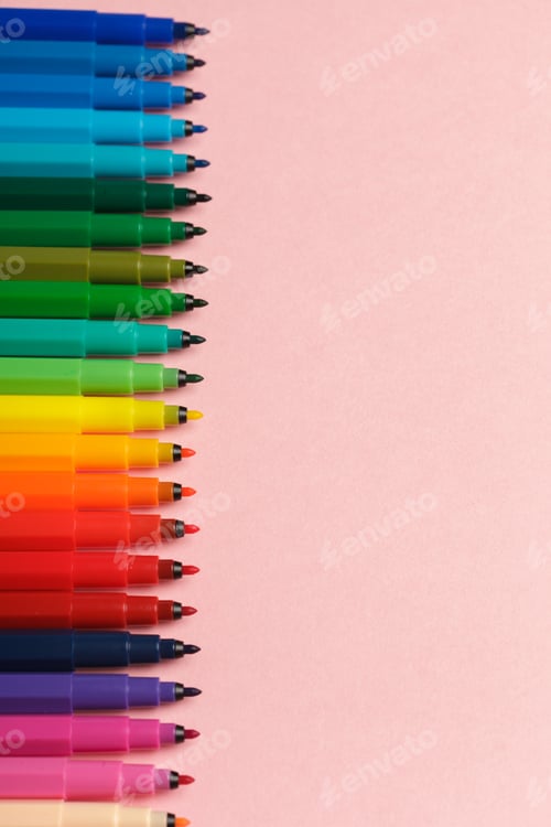 Preview: Assortment of colorful felt tip pens on pastel pink background
