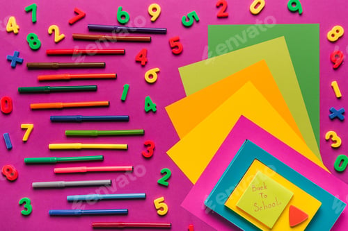 Preview: composition of colorful papers, numbers and markers on purple