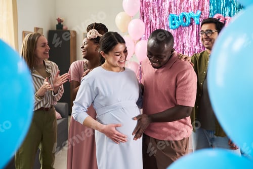 Preview: Diverse Young Adults Smiling and Congratulating Pregnant Woman